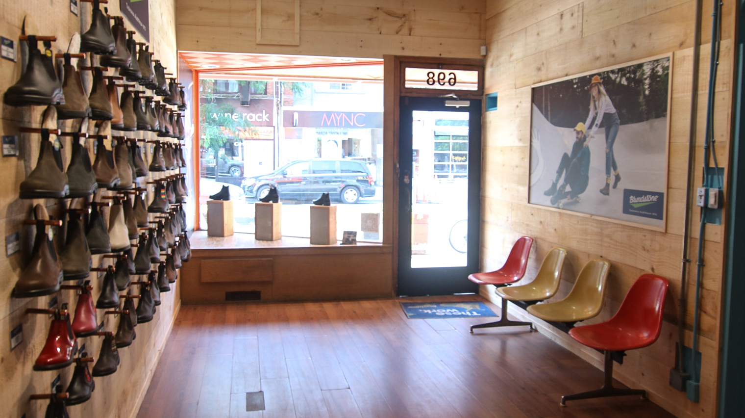 Inside Australian Boot Company store with view out of front window and boot display wall